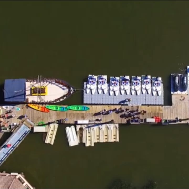Paddle boards, jet skis, kayaks, and boats at the doc