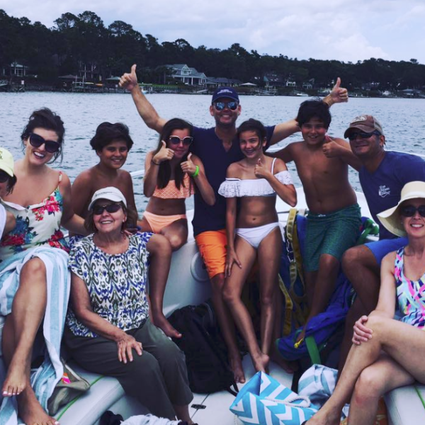 A group of adventurers on the bow of the boat